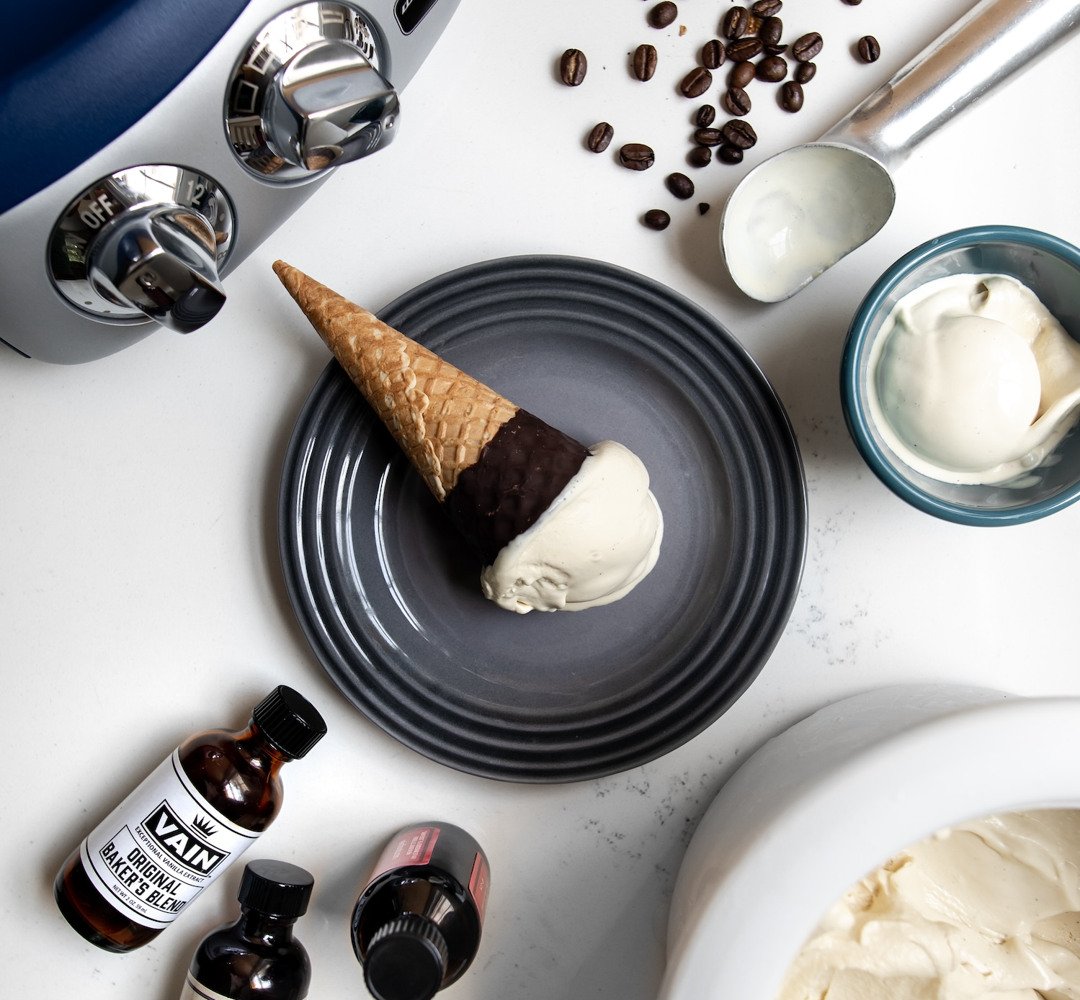 An ice cream cone sitting on top of a plate.