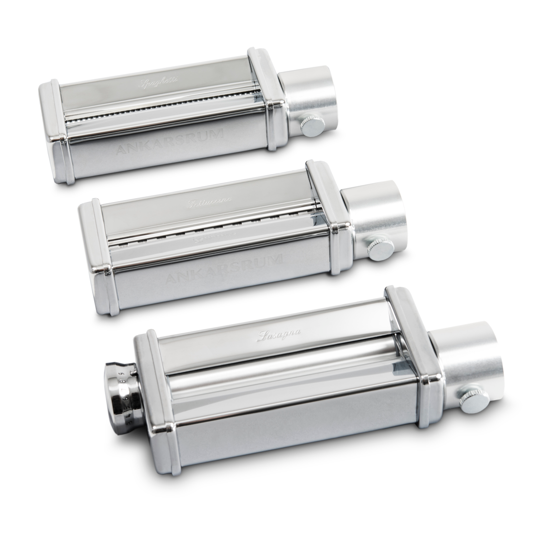 A pair of stainless steel  pastarollers on a white background.