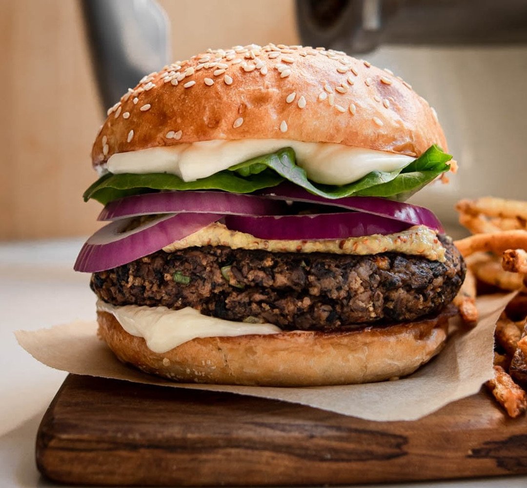 Mushroom walnut burger with a sesame seed bun.