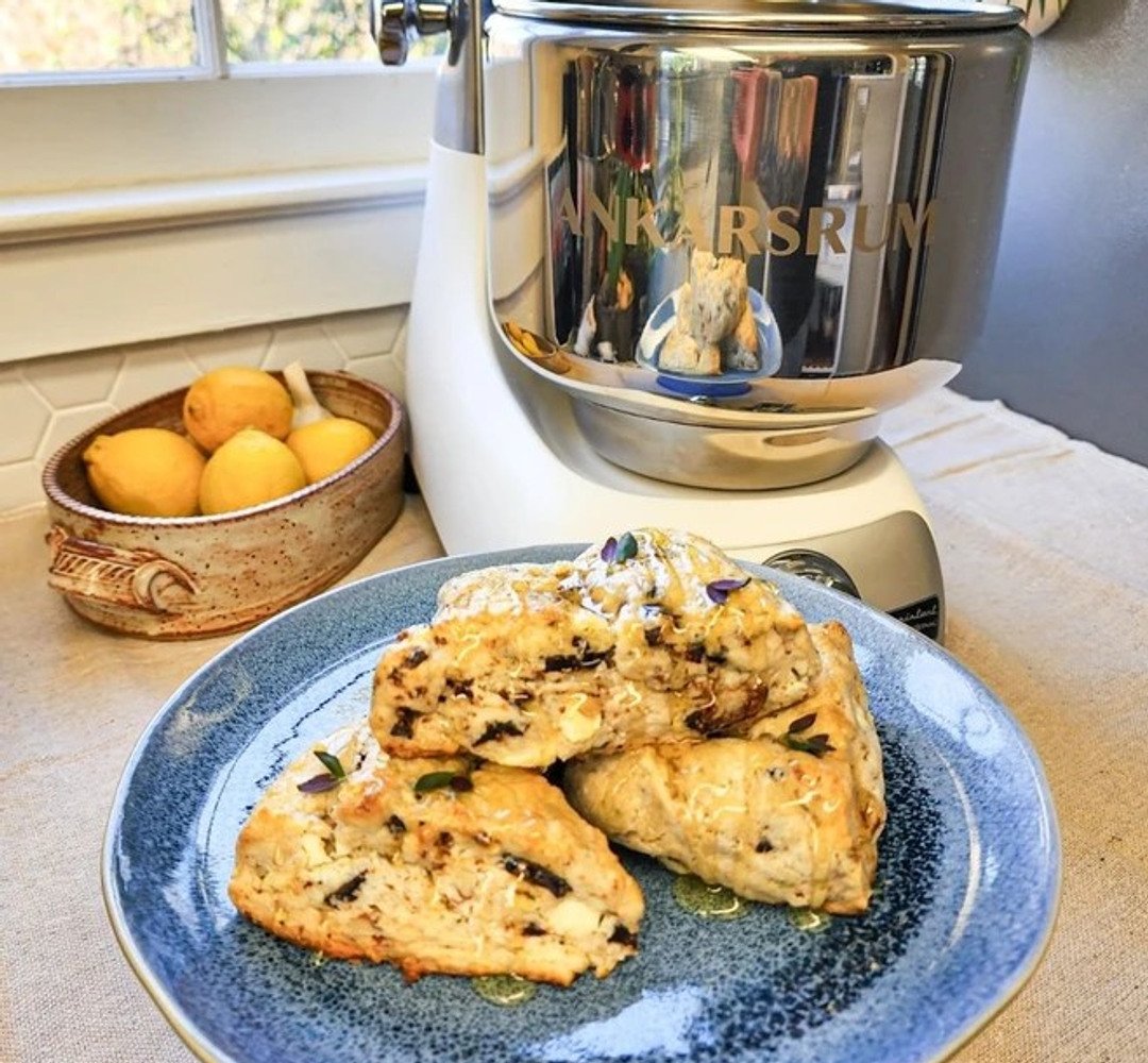 A plate of scones on a kitchen counter. Ankarsrum assistent in the background