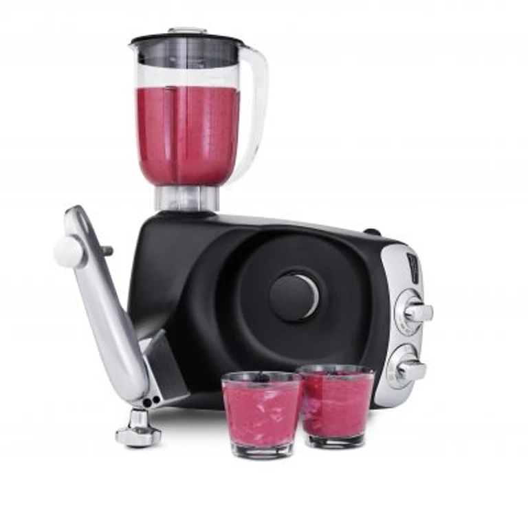 Ankarsrum stand mixer with blender attachment filled with pink smoothie and two glasses of blended fruit drink.