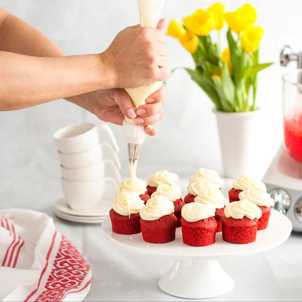 Red velvet cupcakes with cream cheese frosting.