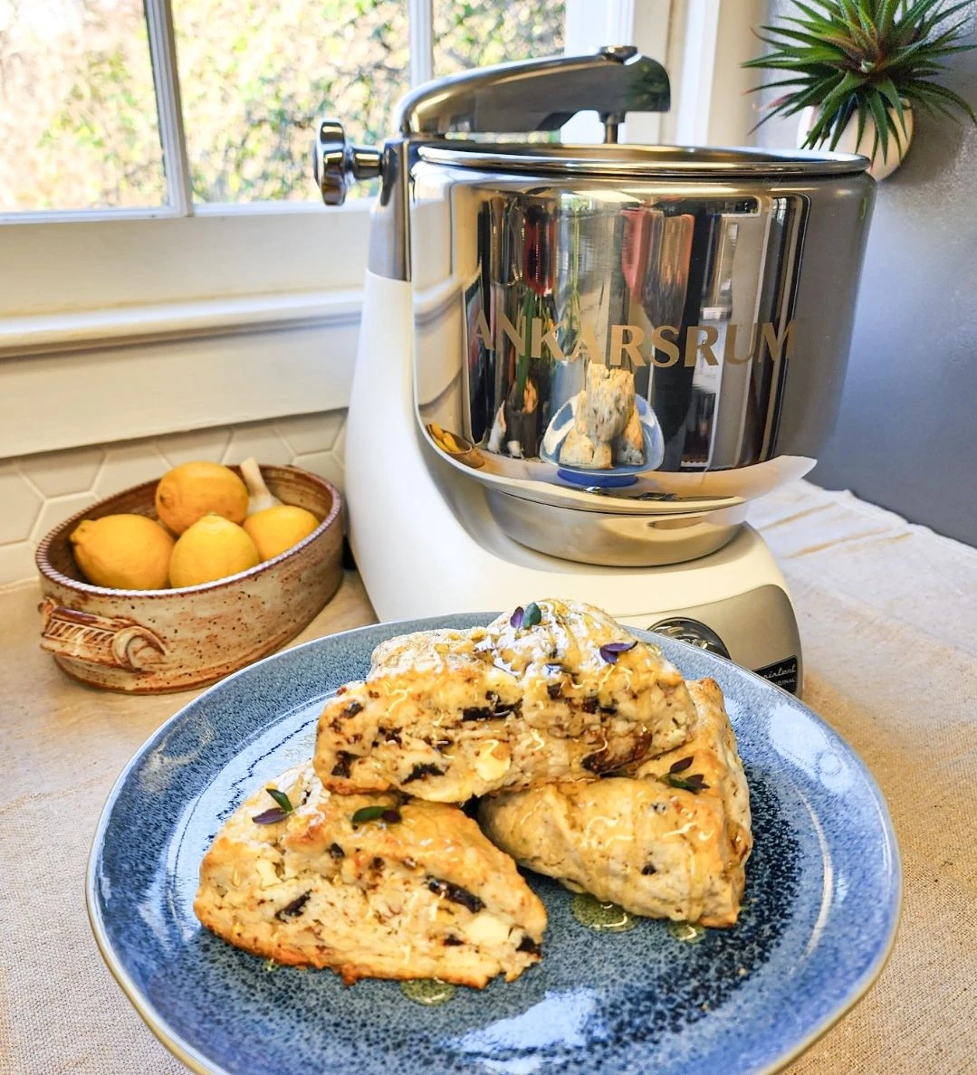 Savory Scones: Freshly baked, homecrafted delights featuring a flavorful blend of herbs, goat cheese, figs, and pecans.