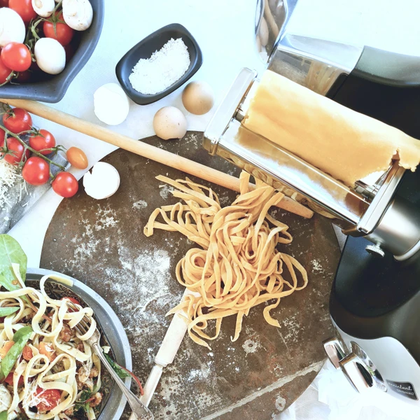 Homemade pasta with oven-baked artichoke and tomato.