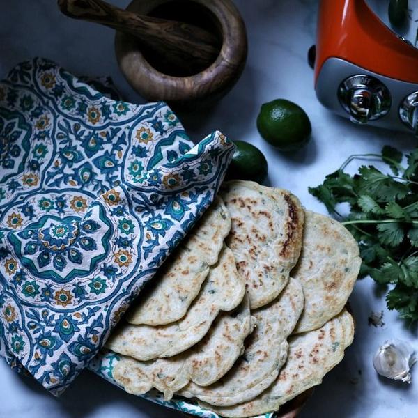 Instead of relying on the traditional gluten-free flours, this yeasted flatbread is actually made with brown rice that has been soaked for 24 hours and then blended with coconut milk and other flavorful ingredients to create something between a flatbread and pancake with a deliciously soft, slightly chewy texture and none of that weird sandiness you usually get from rice flours