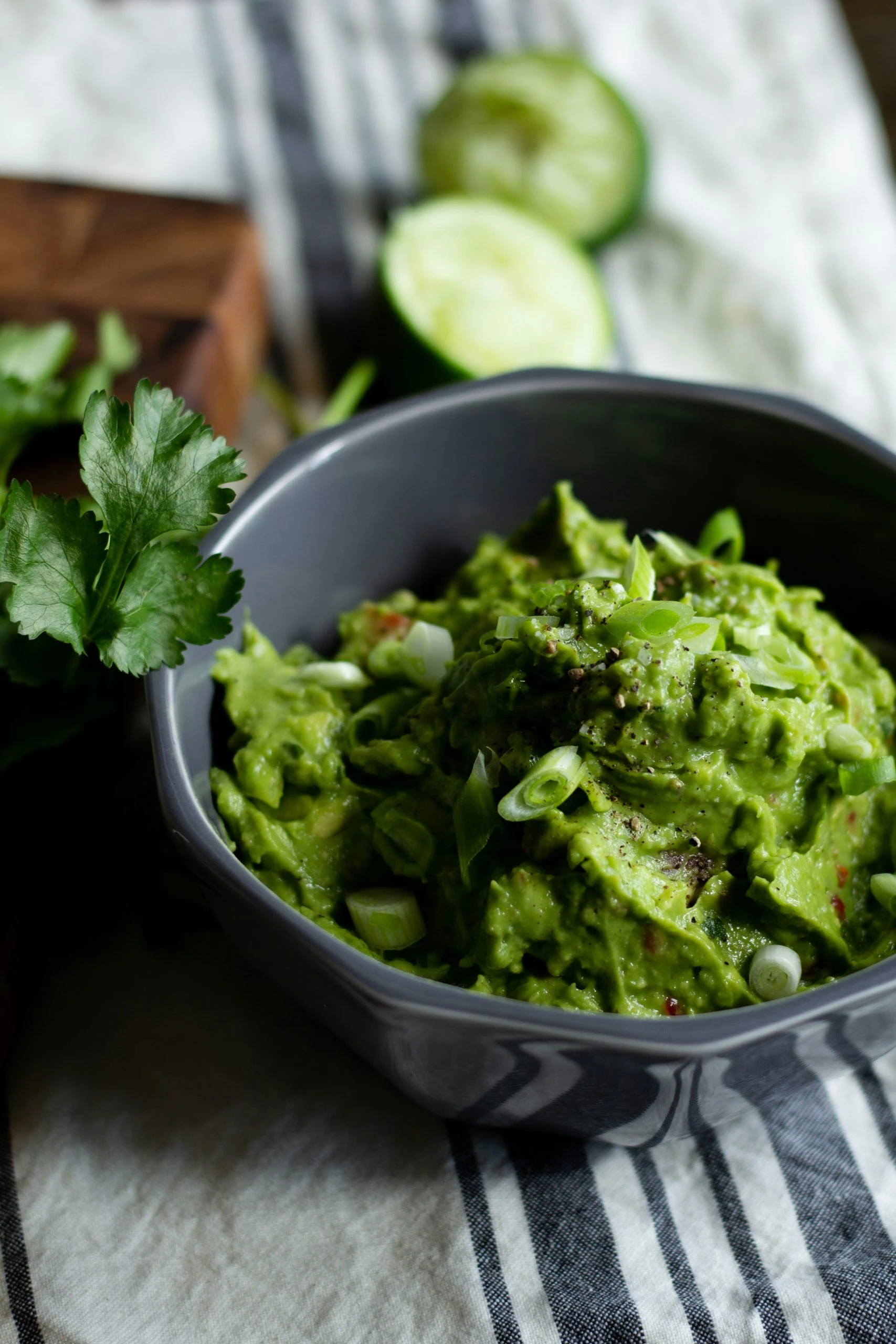 Creamy homemade guacamole prepared in a stand mixer, perfectly blended to a chunky or smooth consistency for the ultimate party dip.