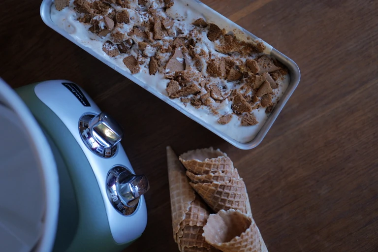 Gingerbread ice cream in a glass with crushed gingerbread cookies as decoration.