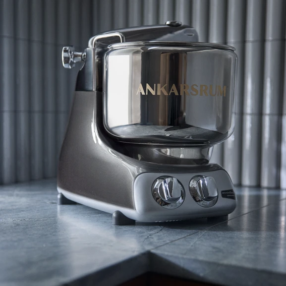 Ankarsrum Assistent Original in Black Chrome in a grey kitchen.