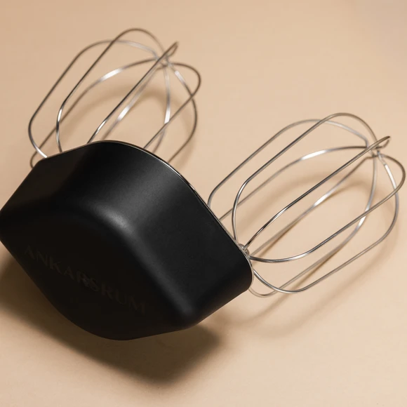 A pair of durable whisk attachments for the Ankarsrum Original Stand Mixer, perfect for creating everything from fluffy meringues to heavy cookie dough from scratch.