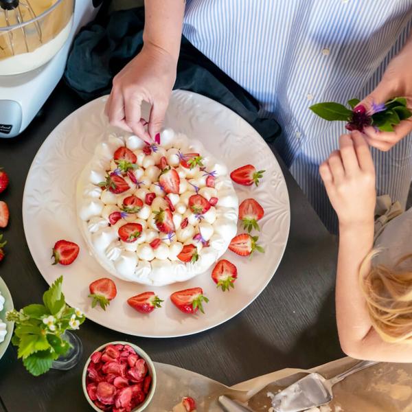 Imagine a crunchy meringue that is filled with a smooth strawberry curd topped with sweet, lightly whipped cream. The cake is easy to make and all parts can be prepared several days before.
