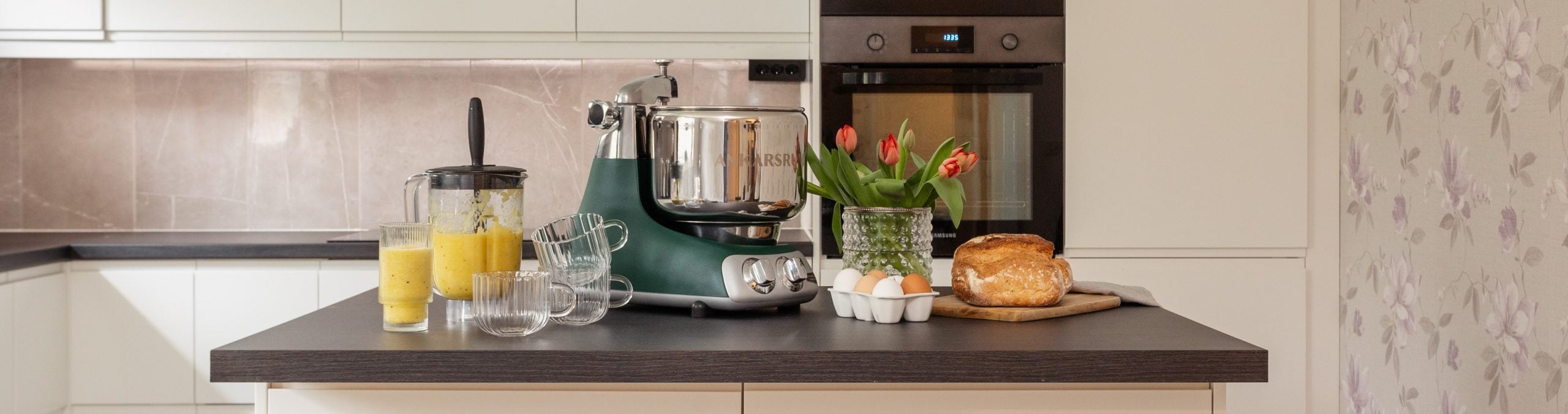 A kitchen with an Ankarsrum Stand Mixer and inspiring food and juice that's been produced using it.