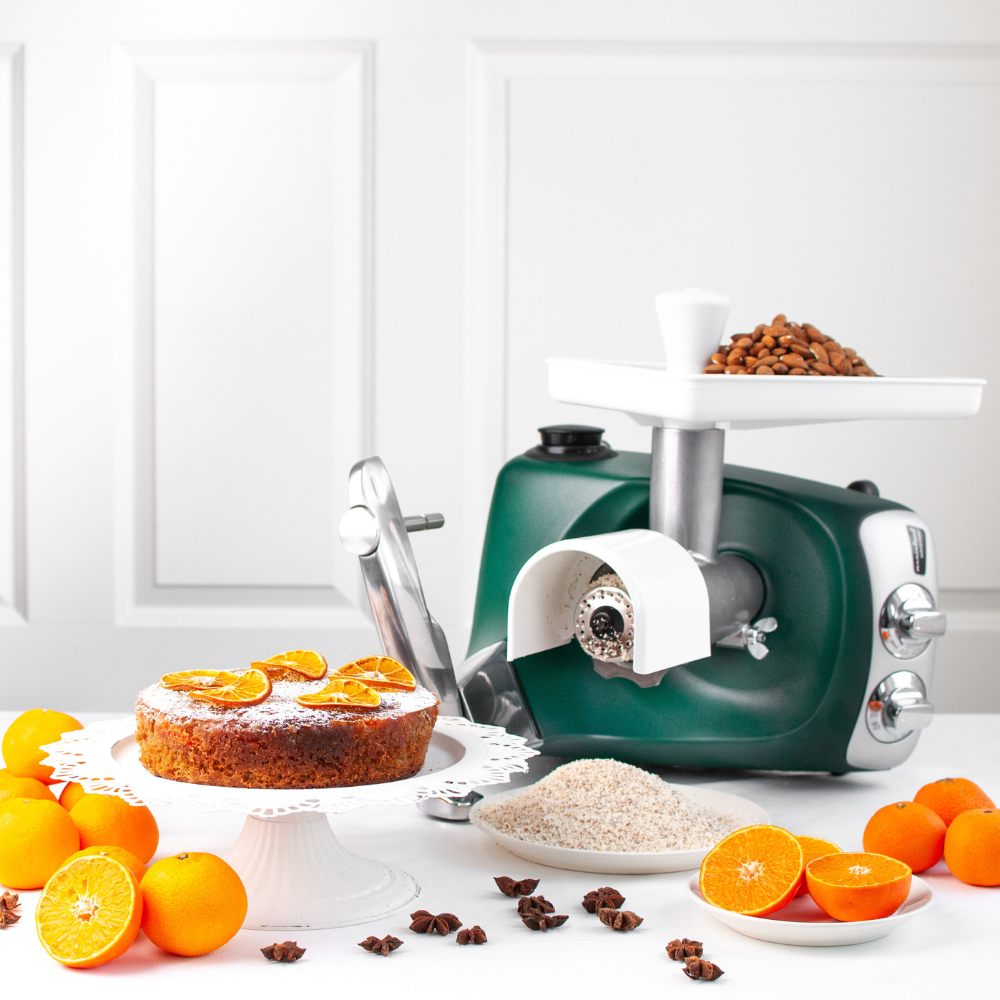 Grater attachment for Ankarsrum stand mixer grinding nuts into flour for baking